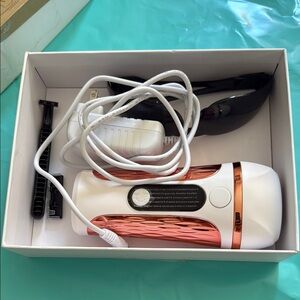 White and Copper Hair Removal Device
